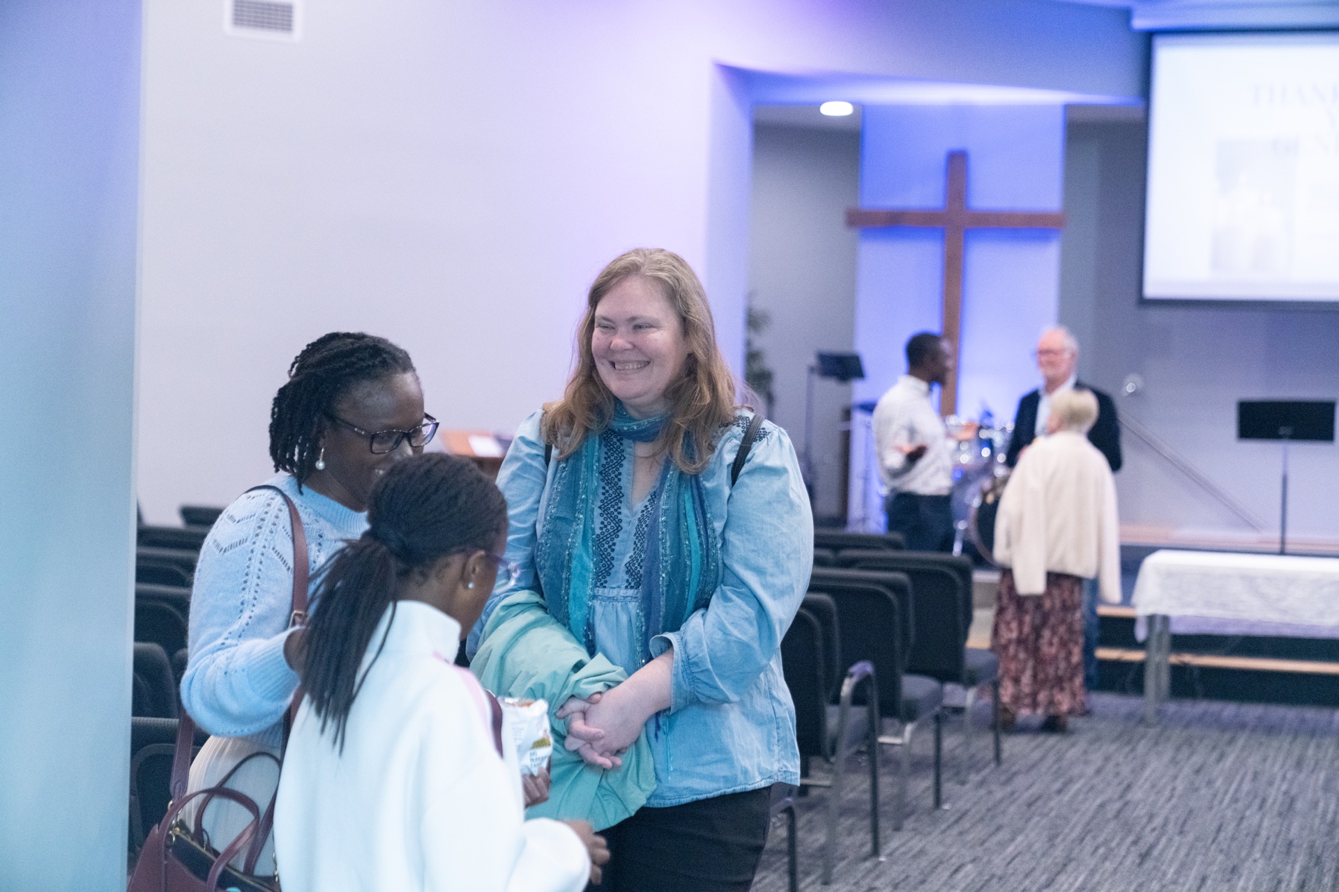 People chatting together inside Springpark Baptist Church