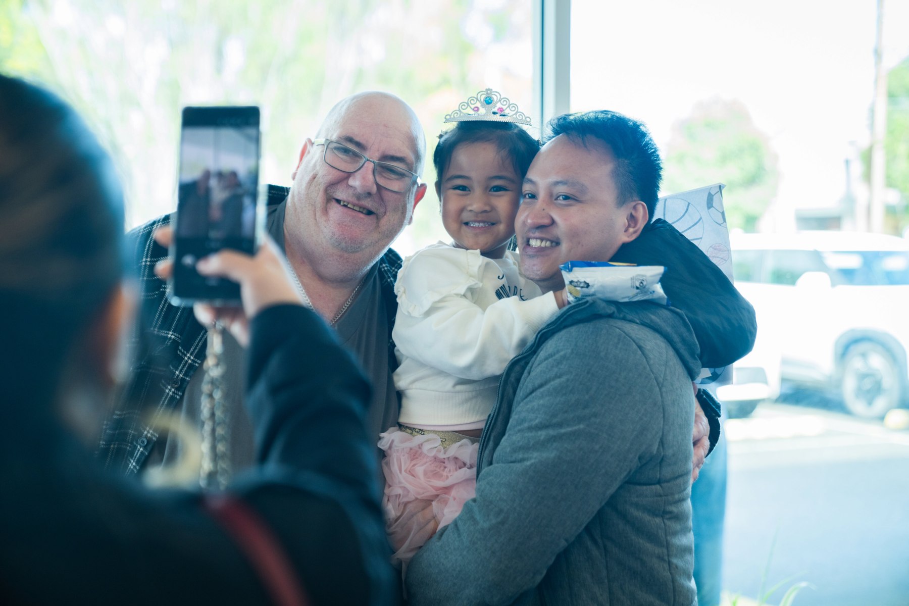 A family sharing a moment together in the foyer