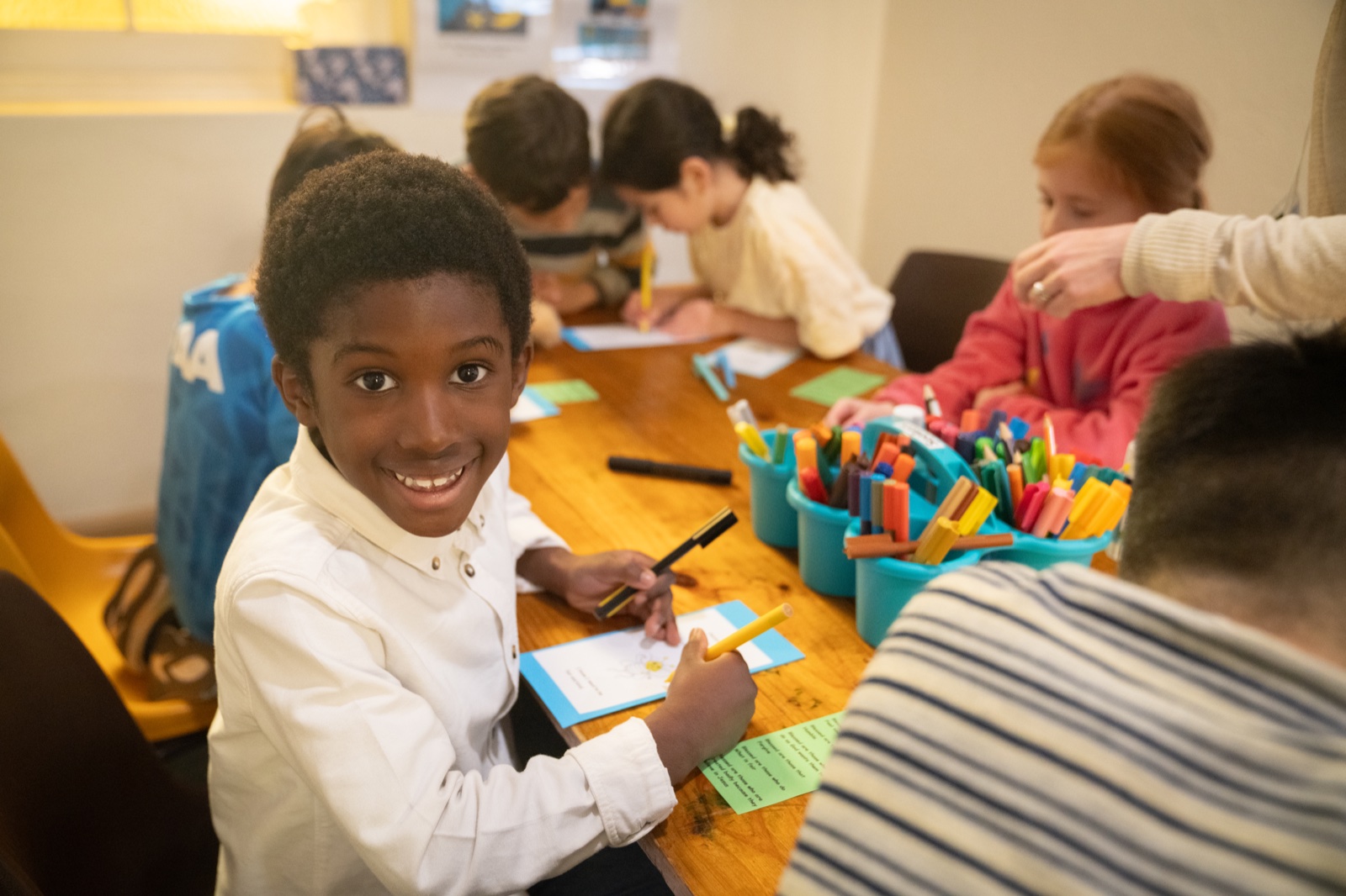 Children drawing and learning together at Seekers